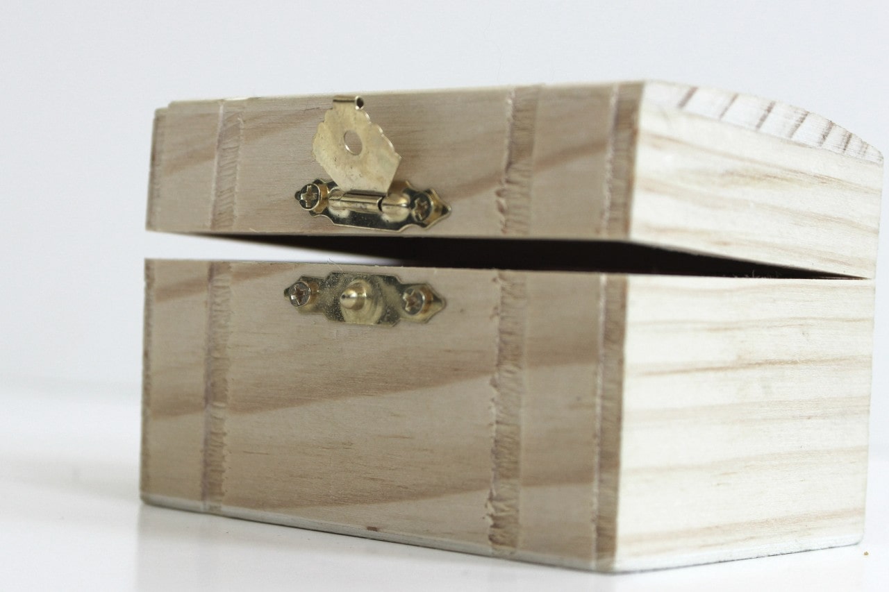 A wooden box from a crafts store is ready for customization